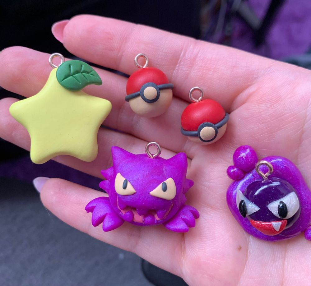 a paopu fruit, two pokeballs, a haunter, and a gastly pokemon clay charm made by cosmicquarts!