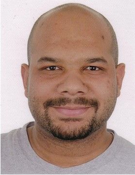 A headshot of Brandon Kilbourne