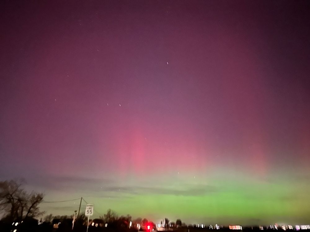 aurora borealis. it is green and pink in waves