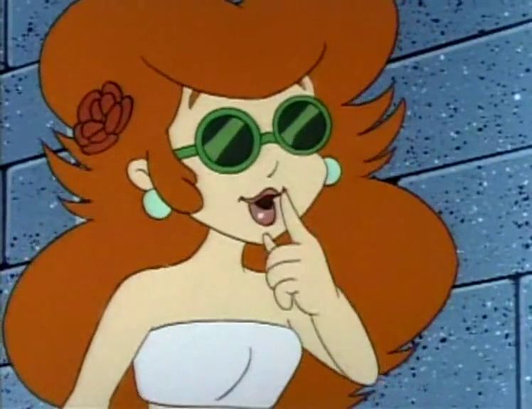 A close-up of Toadstool in the same outfit. Her shades have a dark green tint to them as well.