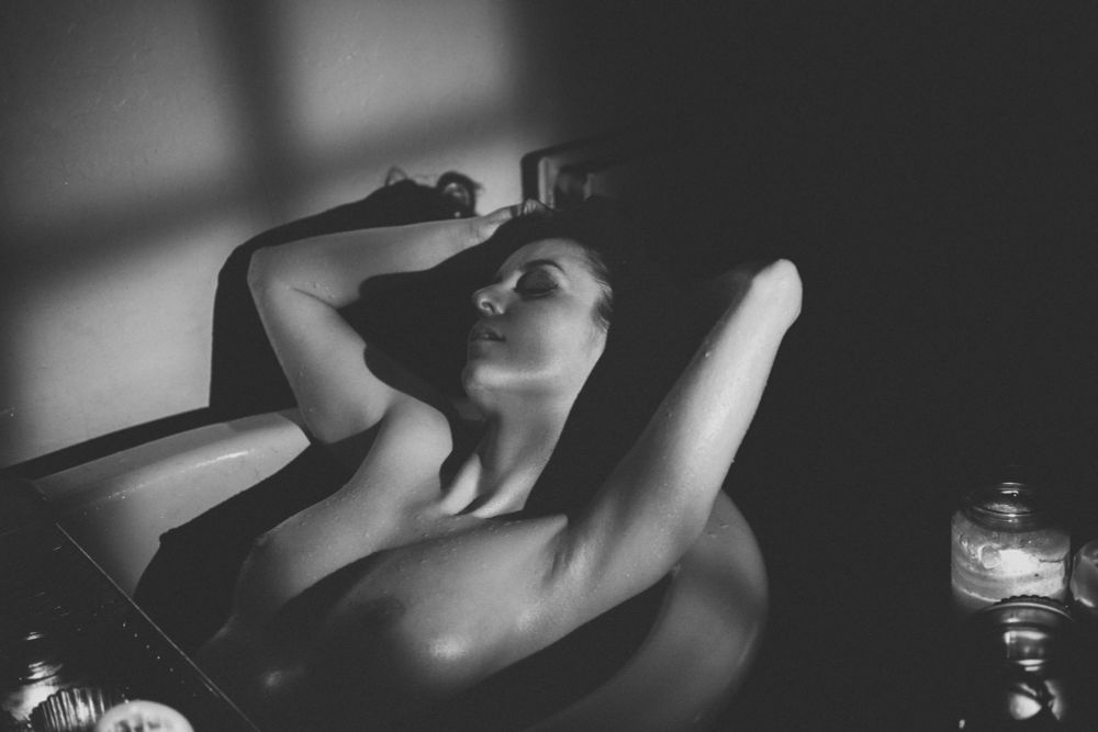 Woman in a Bath with her breasts on show