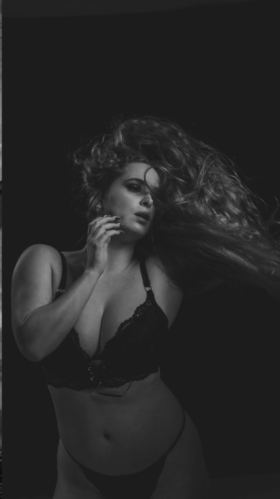 Woman in lingerie with flowing long hair  