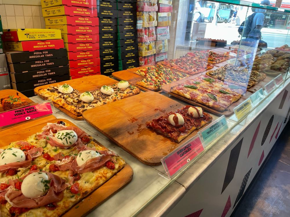 Unregular pizza nyc pizza window