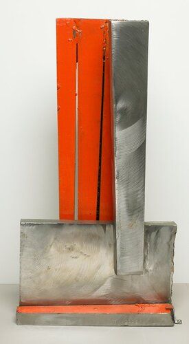 nine roughly hewn pieces of stainless steel welded together; 2 surfaces painted orange