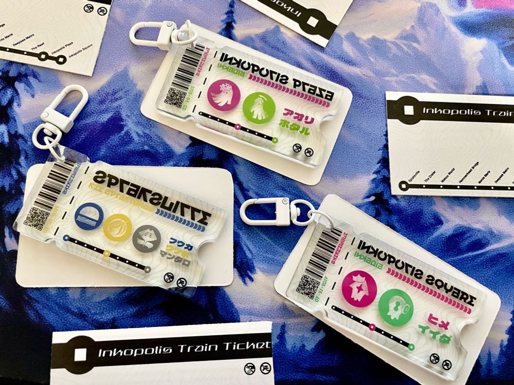 An image of sketchwave’s new inkopolis train ticket charms, available starting tomorrow at 12p est!