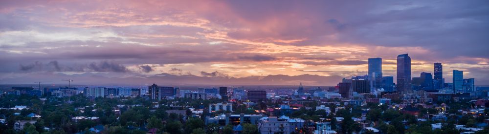 Pink and purplish-blue clouds at sunset over Denver.