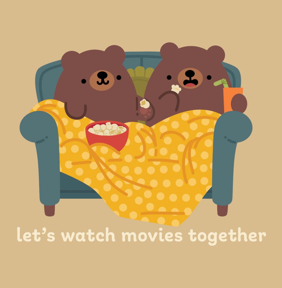 illustration of two brown bears on a blue couch, eating popcorn from a red bowl and draped in a yellow polka-dot blanket. the bears are looking at each other while eating popcorn. the one on the right holds a cup with a straw. under the illustration is text that reads "let's watch movies together" they look like they are having a good time
