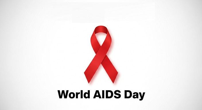 A red ribbon symbolising HIV and AIDS awareness, shown above the words ‘World AIDS Day’ on a plain white background.