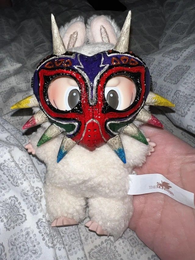 A Labubu wearing a handcrafted Majora's Mask, befitting the pun