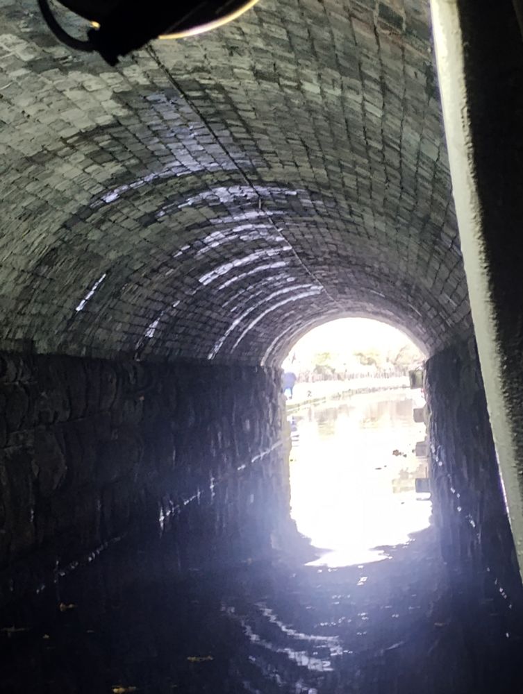 The exit of the canal tunnel with bright light shining in