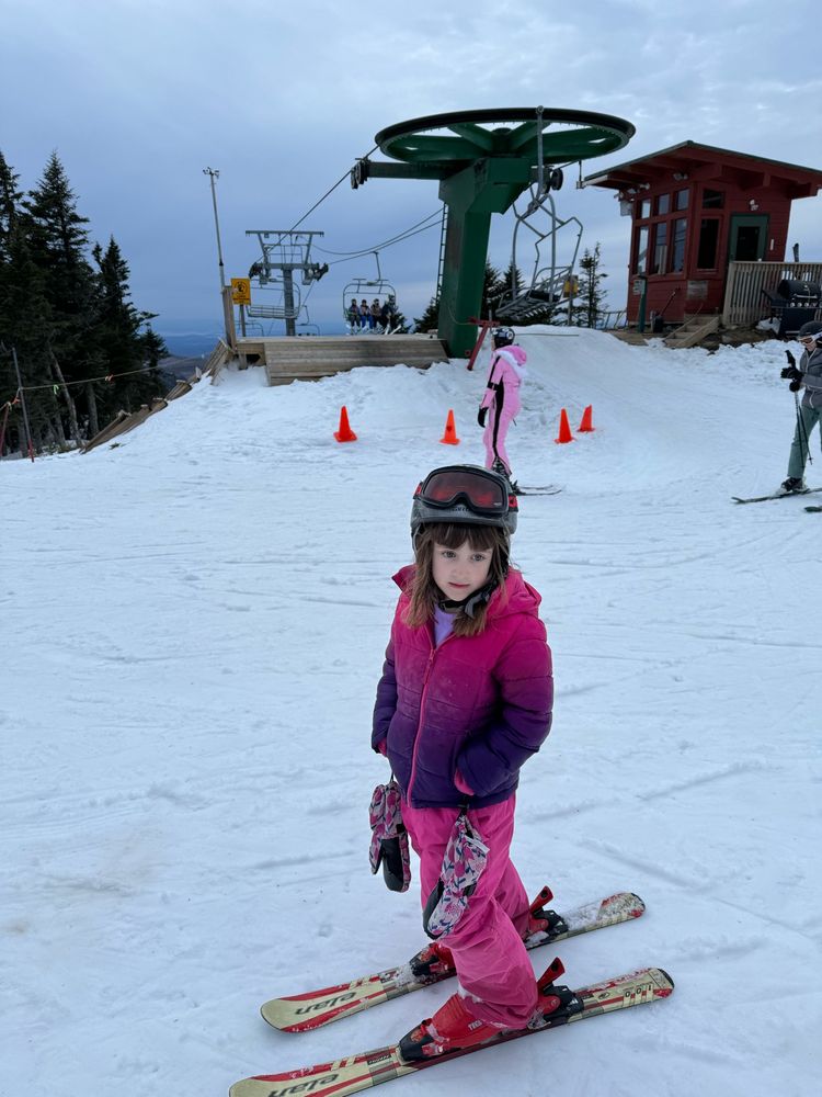 Six-year-old on skis at the top of the chairlift at Bolton Valley, Vermont. 