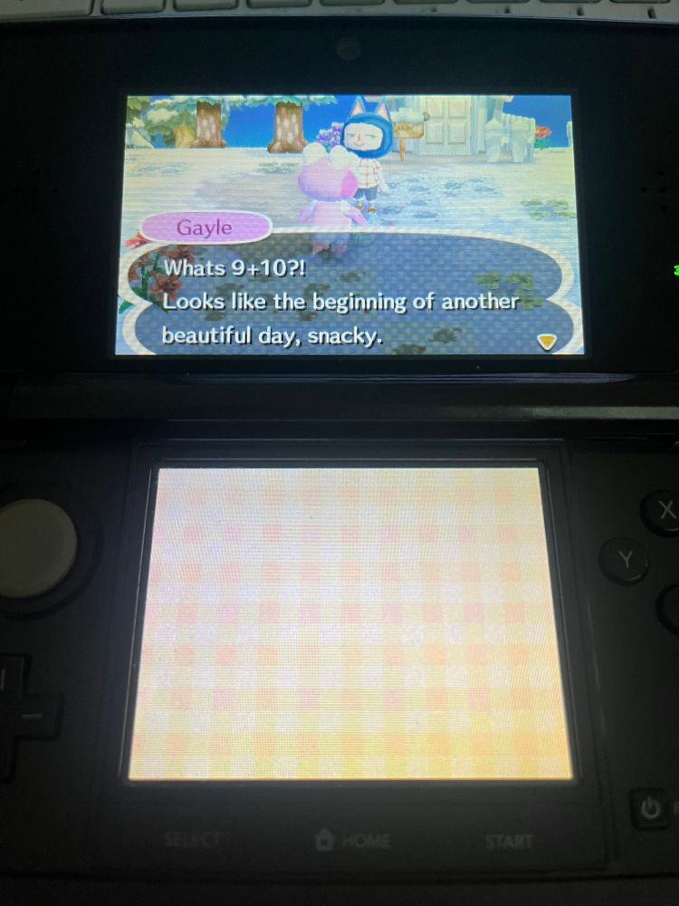 A picture of a 3ds with animal crossing on the screen. A pink alligator is making a very well known joke, that being: what’s 9+10?