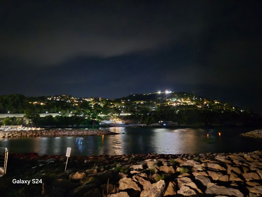 A seaside town at night.