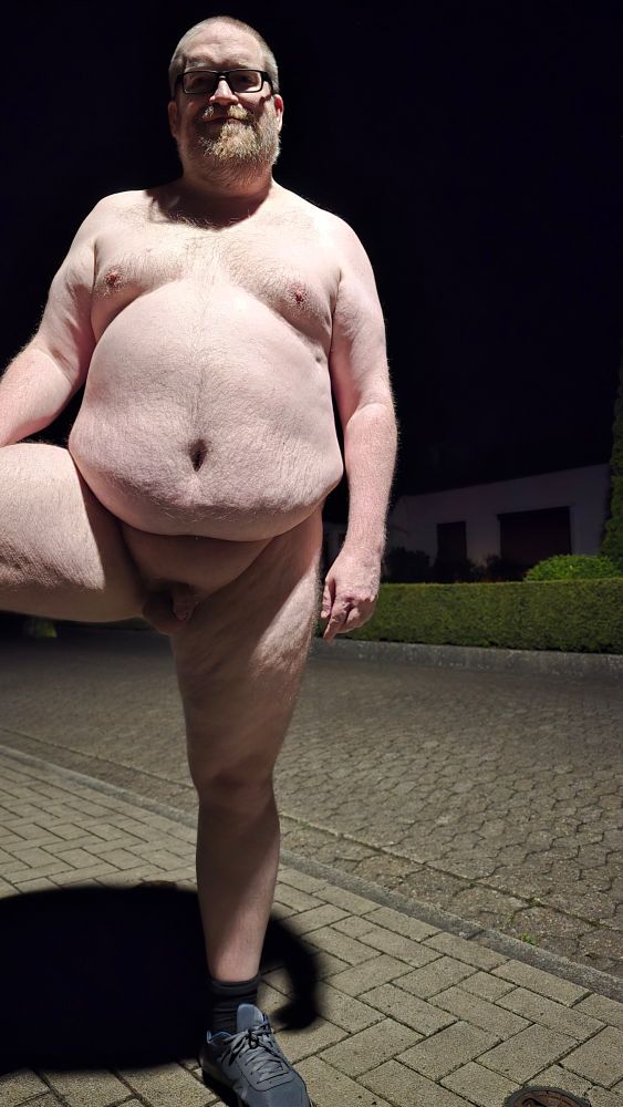 Naked man on the sidewalk.