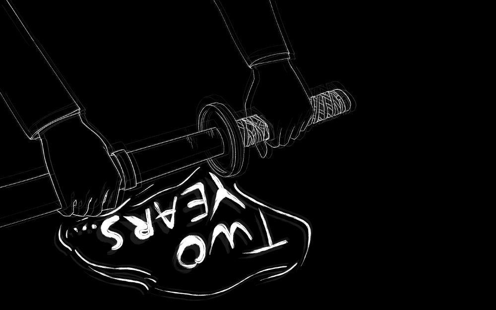 A sword being drawn from a sheath. It reads 'two years." 