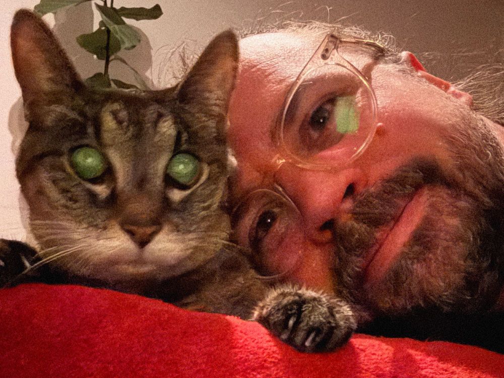 Rob Keller cuddling with his cute cat Cosette.