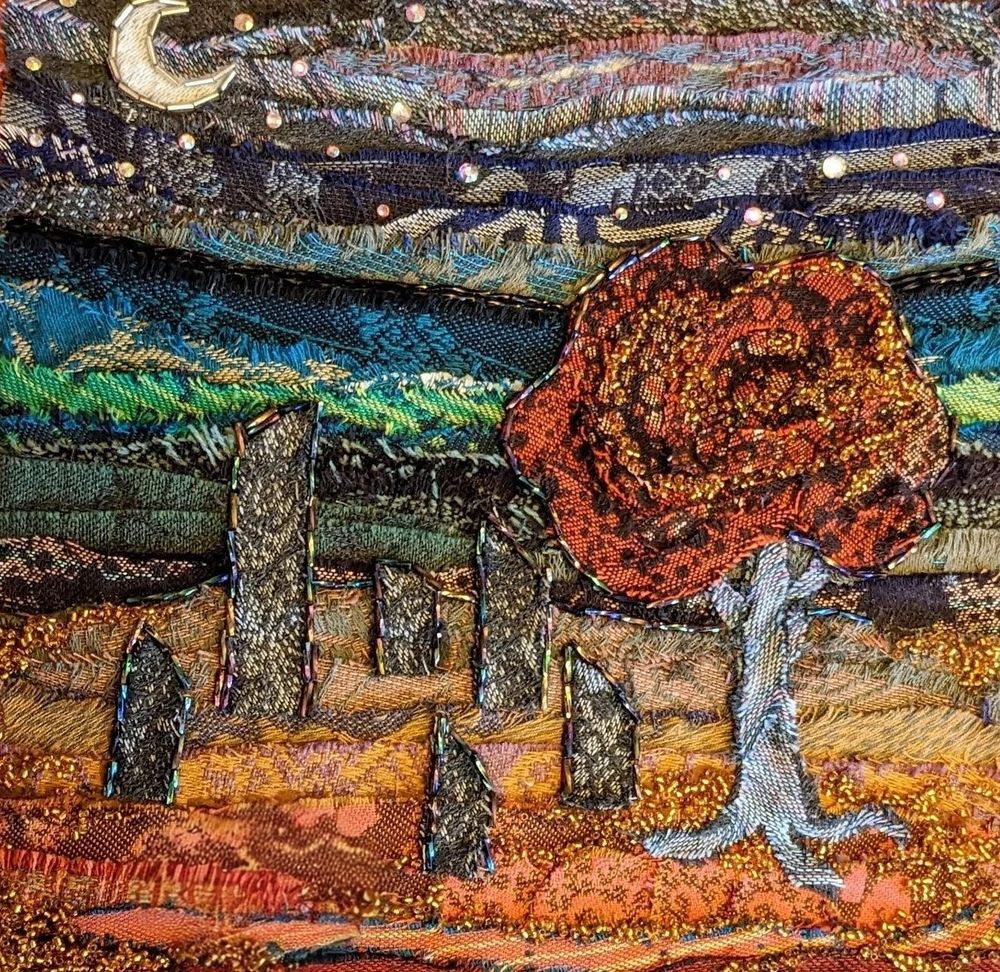 Glued collaged fabric - an Autumn scene at night with a moon tree with orange leaves and a stone circle. Slightly abstract. 