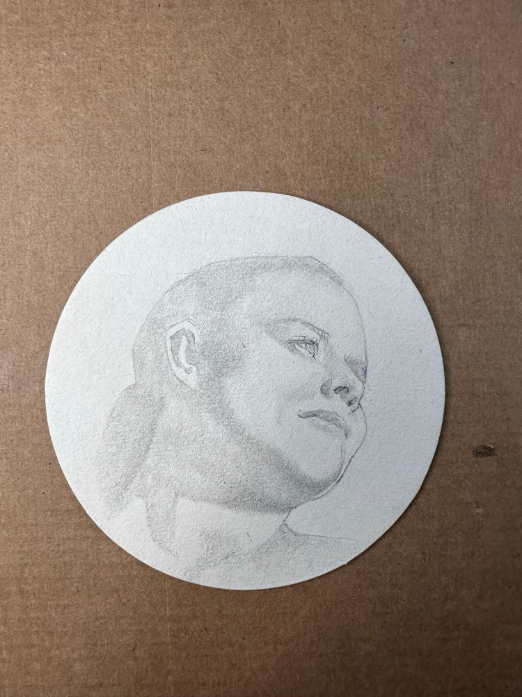 Progress shot of a drawing of female portrait. Blocking general shapes of light and shadow