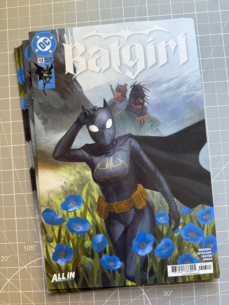 Batgirl #13 copies on my work desk