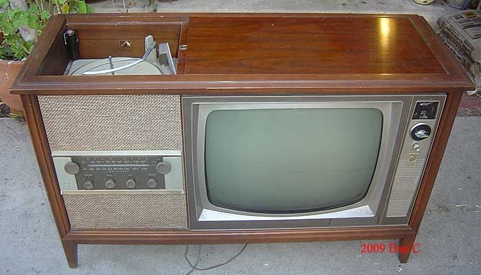 1964 TV wood console with black & white TV and stereo.