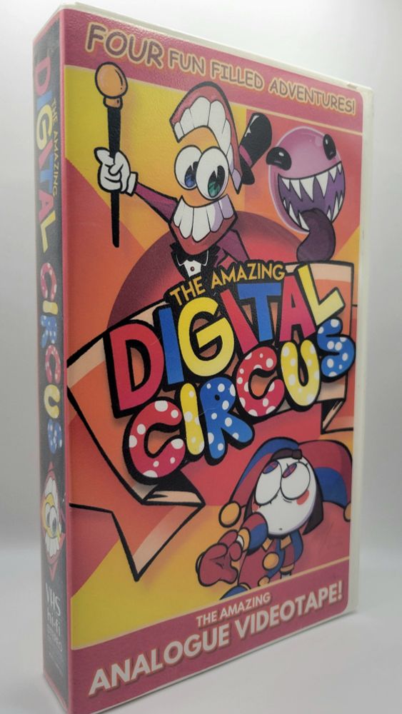 The front cover depicting the helpless Pomni at the mercy of her overlord Caine and his degenerate familiar Bubble