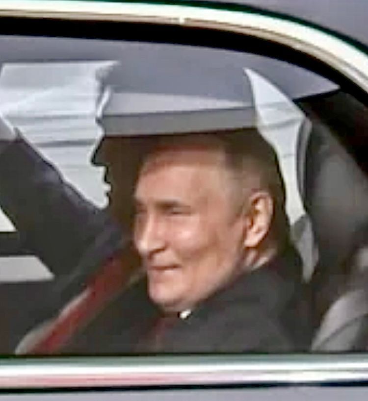 Putin’s shit-eating grin riding in The Beast