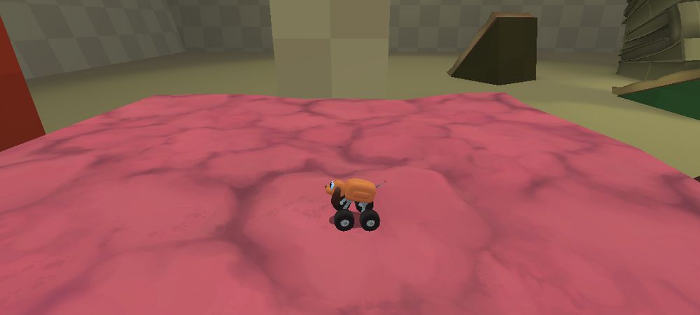 puppy truck stands upon a pink mound meant to be pink insulation wool, but instead looks quite a bit like a pile of flesh