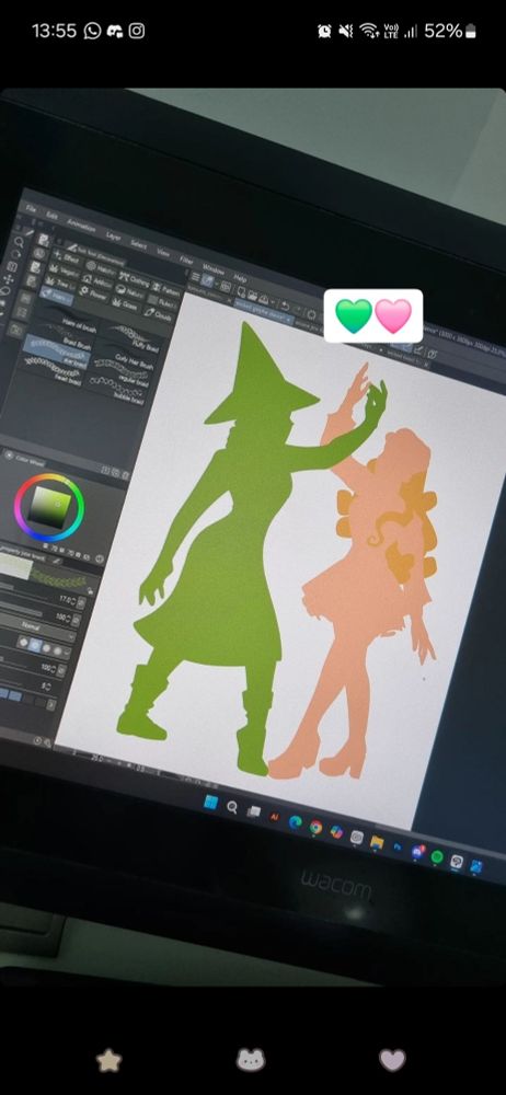 Drawing of green and pink silhouettes of a work in progress of Elphaba and Glinda dancing, from the musical Wicked