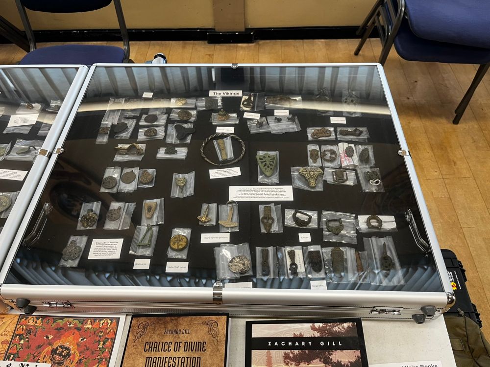 Photo of historical artifacts displayed during Exiles of the Golden Age showing design features of the venue's interior walls. Source: twitter.