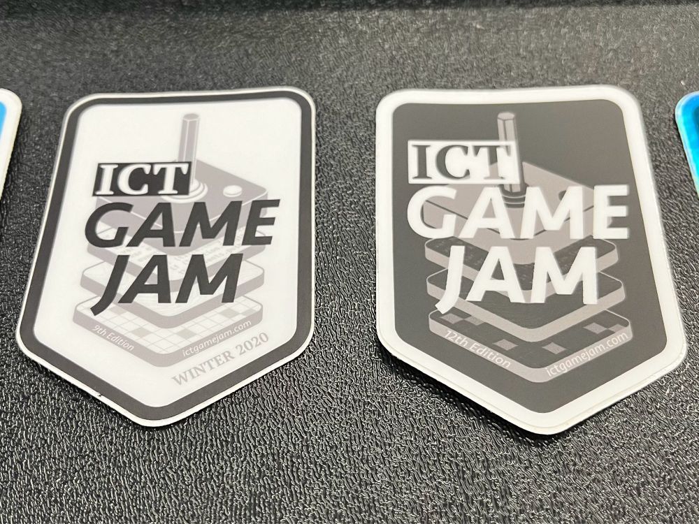 A white sticker and a black sticker.