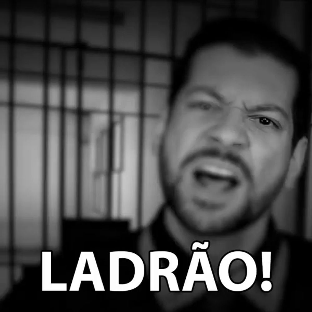 a black and white photo of a man with the words ladrao on the bottom right