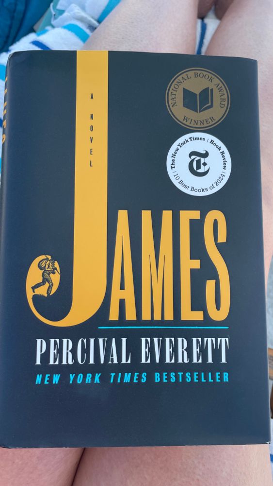  A black book cover with gold letters. It reads “James by Percival Everette”