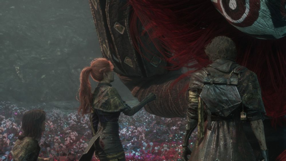she's putting her hand out like it's the friendly neighborhood cat and it's gonna sniff her and be like "hell yeah pet away bro" but it is, again, a giant boss, a monster of sorts. gustave looks on, ANGRILY