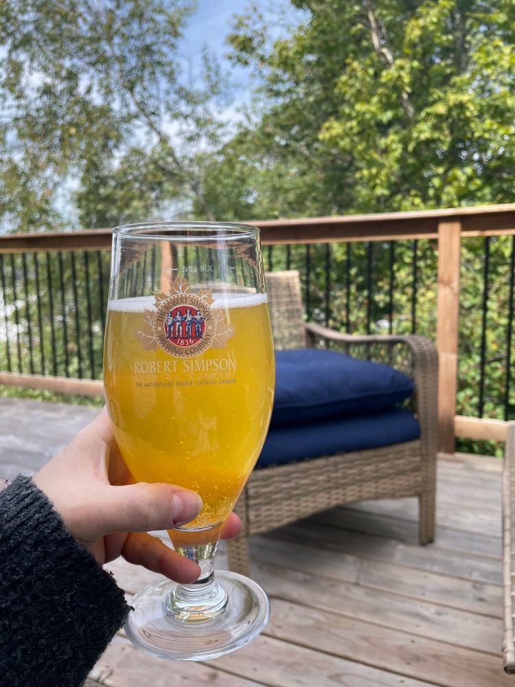 Good Robot pineapple lime radler on a back deck 