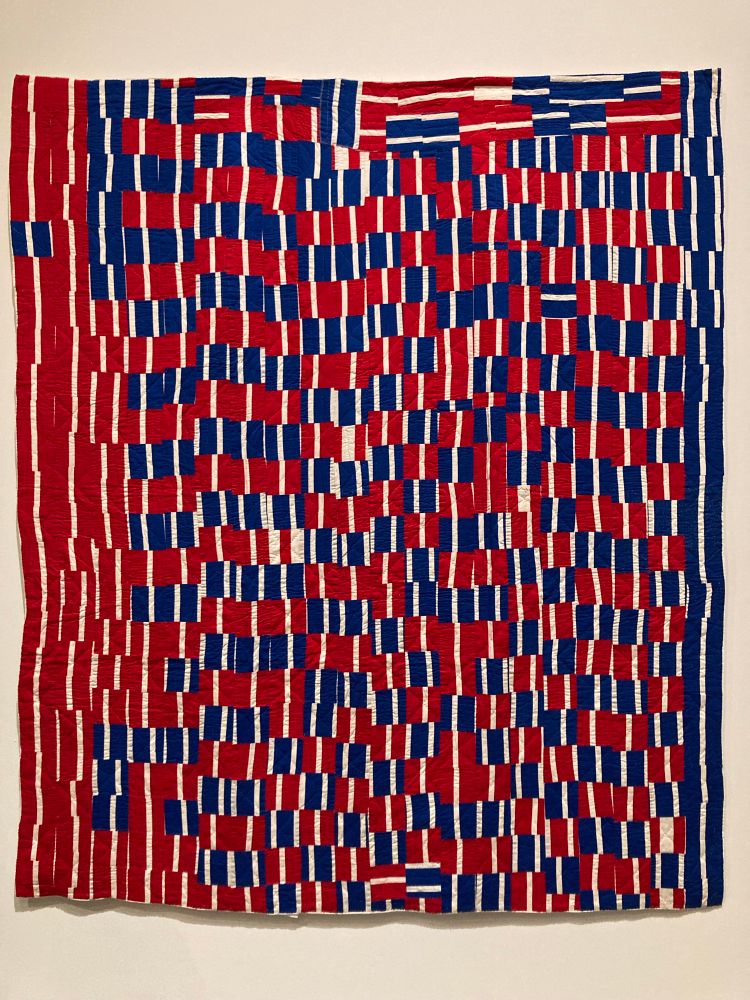 Red, white, and blue mostly vertical rectangular pieces moving into an increasingly faster rhythm left to right. A few squares turned horizontally for variation. Real fun. Best seen whole. 