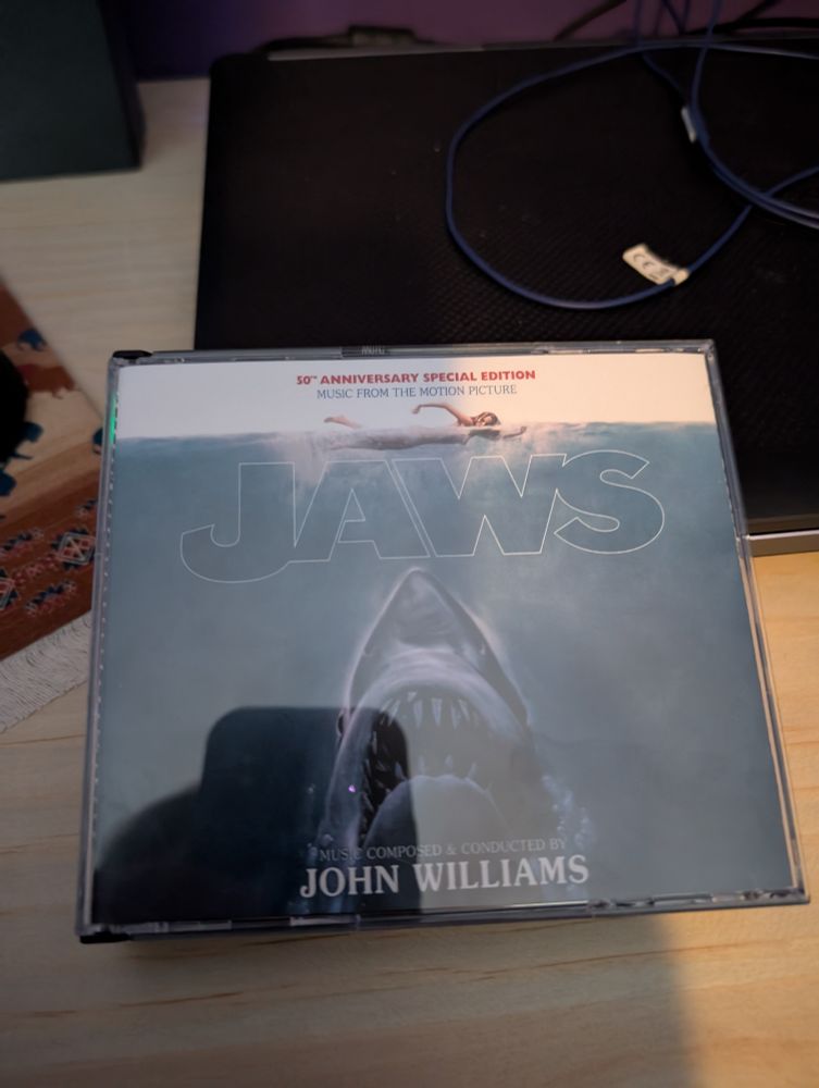 Front cover of the 3CD set of the 50th anniversary edition of the soundtrack to Jaws, by John Williams