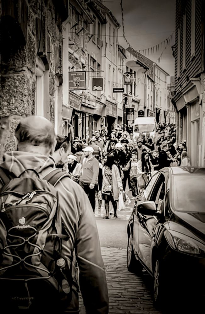 Black and white image of crowded street in St. Ives, Cornwall. 