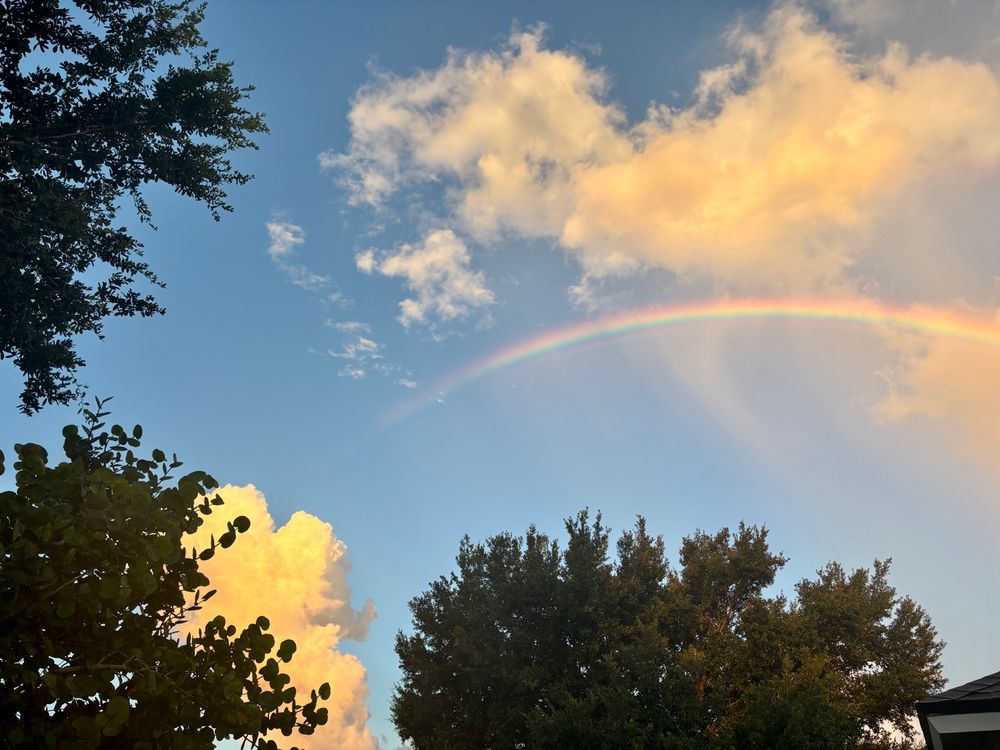 Sunrise on the west coast of Florida. Was pleasantly surprised by a rainbow. 