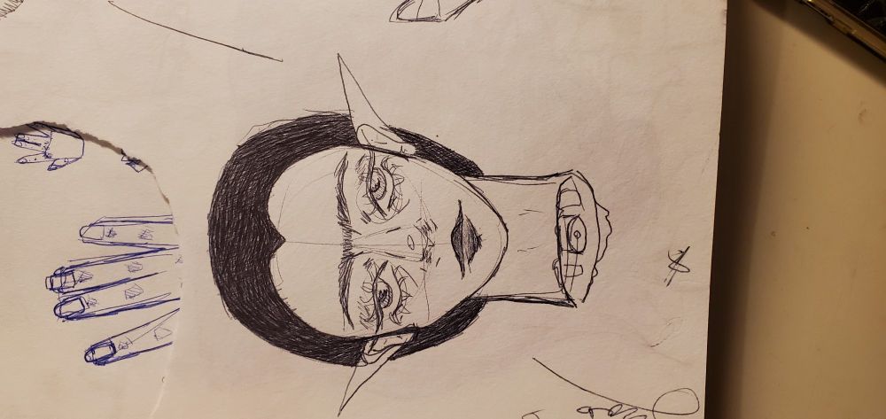 Black pen sketch of disembodied elf head.