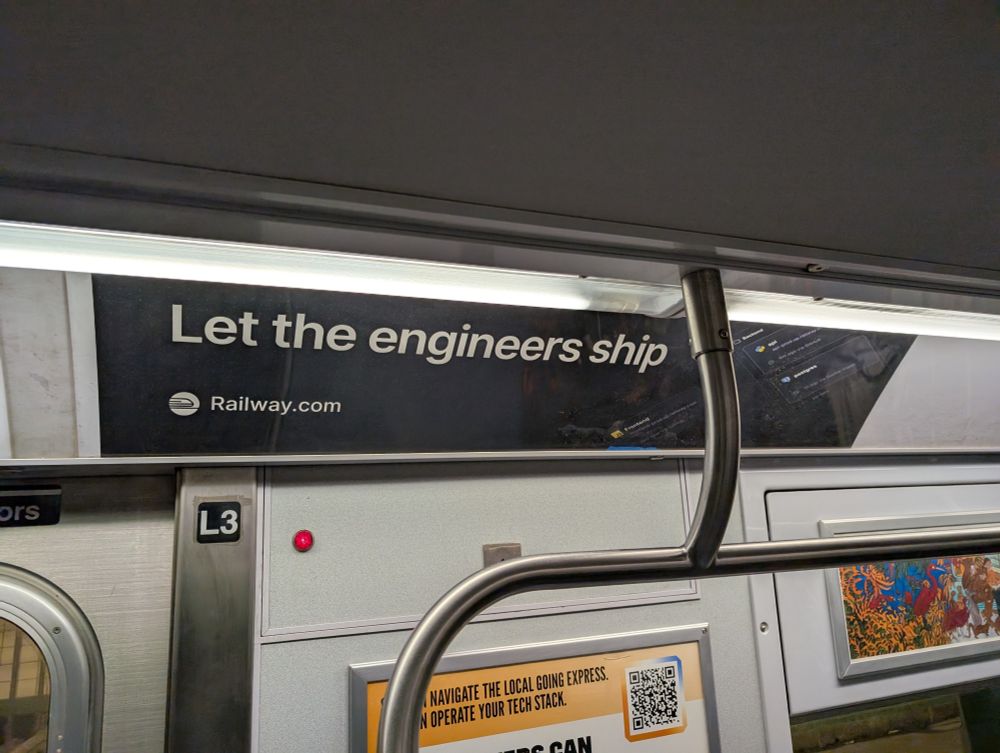 Billboard ad on the NYC subway train for Railway.com, with the tagline "Let the engineers ship"