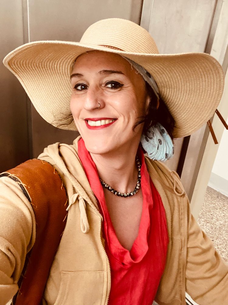 wide brimmed straw hat selfie