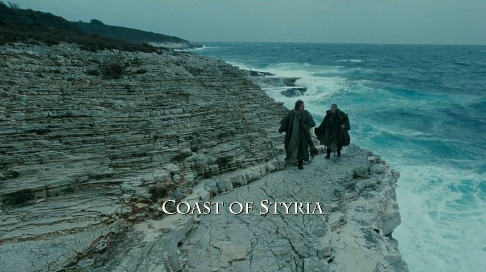 two persons walking along a sea cliff
“Coast of Styria” superimposed, apparently from a time when Styria was still connected to the sea (it never was but hollywood is made of plywood so)
