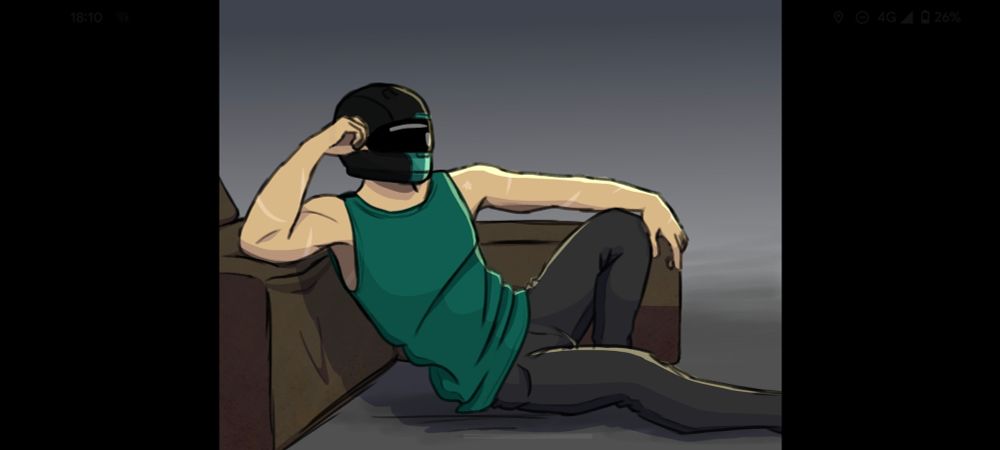 Alistair is sitting on the floor, leaning against the seat of a couch. He has one elbow propped up and is wearing his biker helmet, a teal singlet and dark grey pants.
