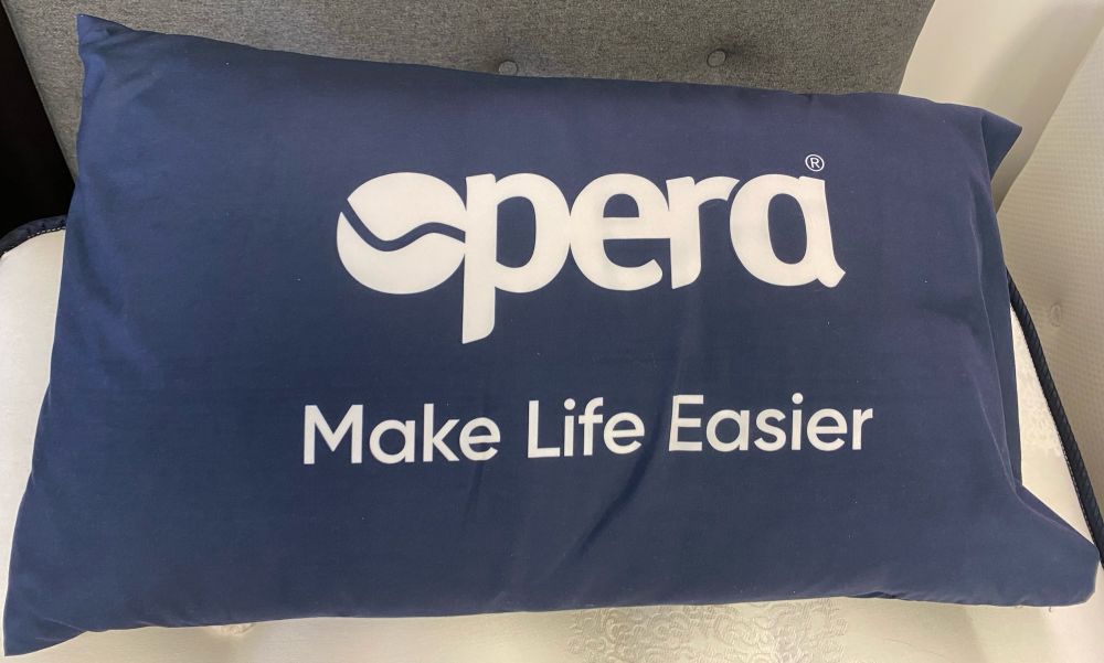 Pillow with text ‘opera make life easier’