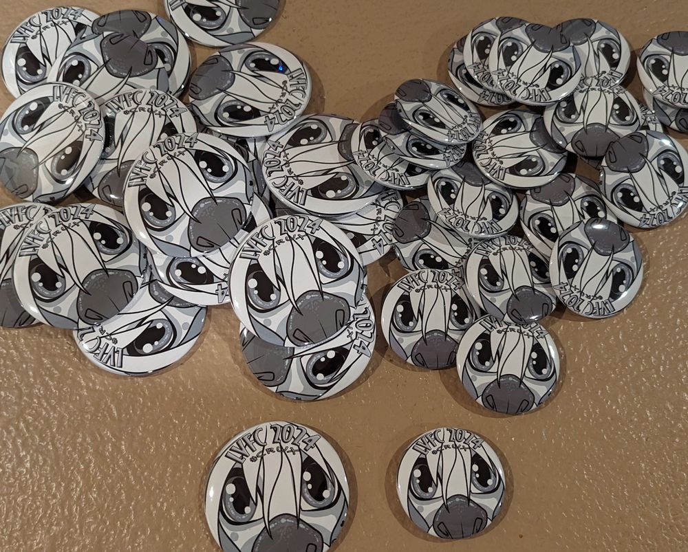 A pile of handsome crux buttons and pins!