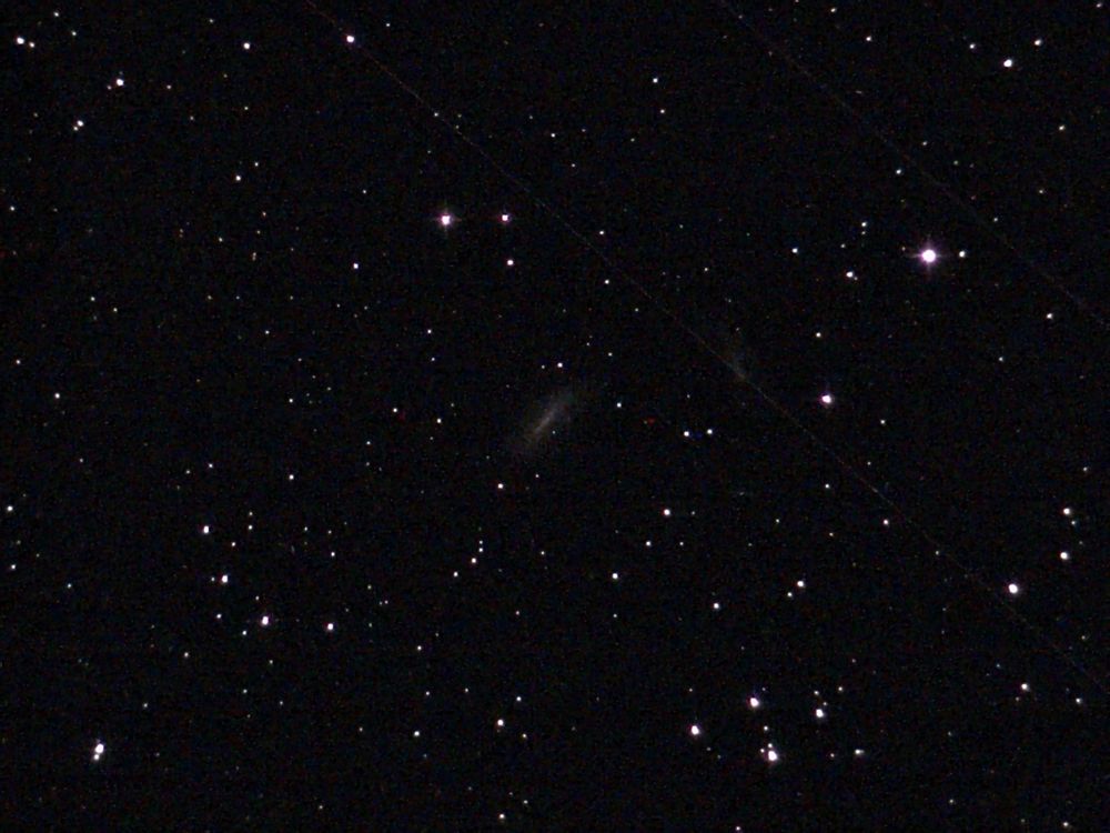 NGC 0672 and IC 1727 Galaxies - unprocessed image.  IC 1727 is an irregular galaxy that shows more distortion and asymmetry than its partner, NGC 0672, due to their interaction.