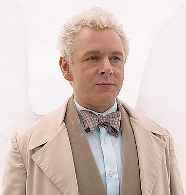 Aziraphale, an angel all dressed in light colours.