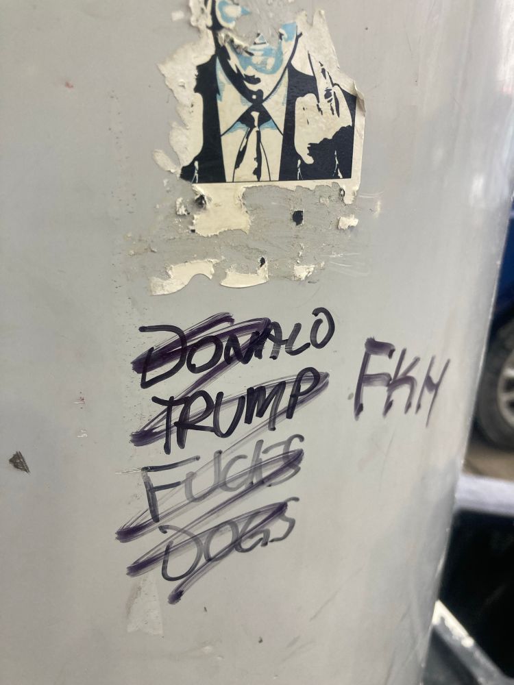 Gas station pump graffiti in black sharpie