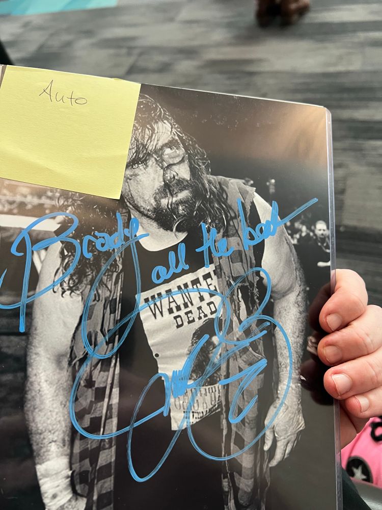 Mick Foley’s autograph. “Brady, all the best”