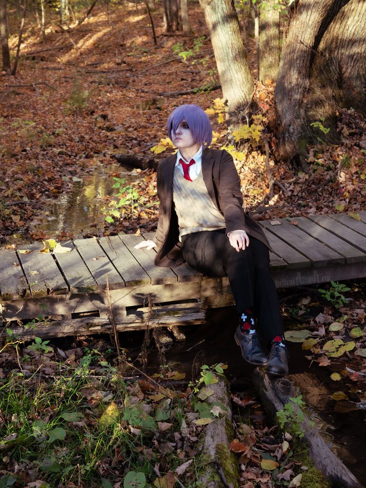 Azura as Yuri from DDLC, sitting on the foot bridge with their dress shoes propped up on a log in the stream, one hand on their knee and leaning back on the other. Dappled sunlight filters through the trees onto them and the floor of orange leaves.